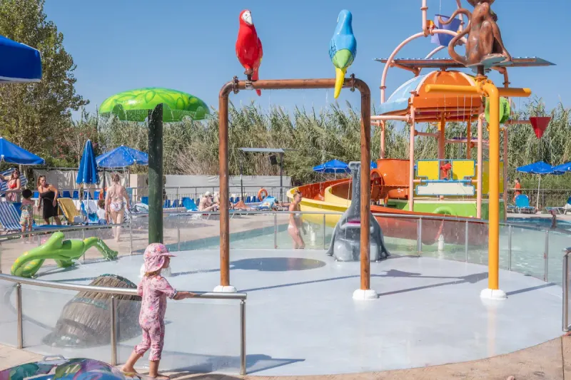 Children splash area with water toys and sunbeds