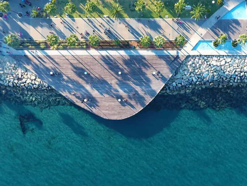 Aerial view of the seafront deck over clear water