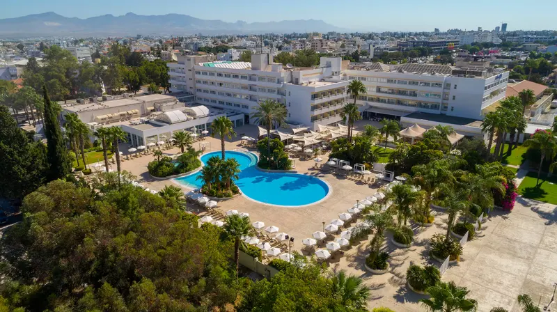 Hotel and pool garden with Nicosia and the mountains behind