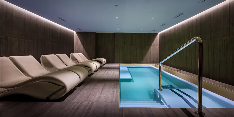 Indoor plunge pool with spa loungers