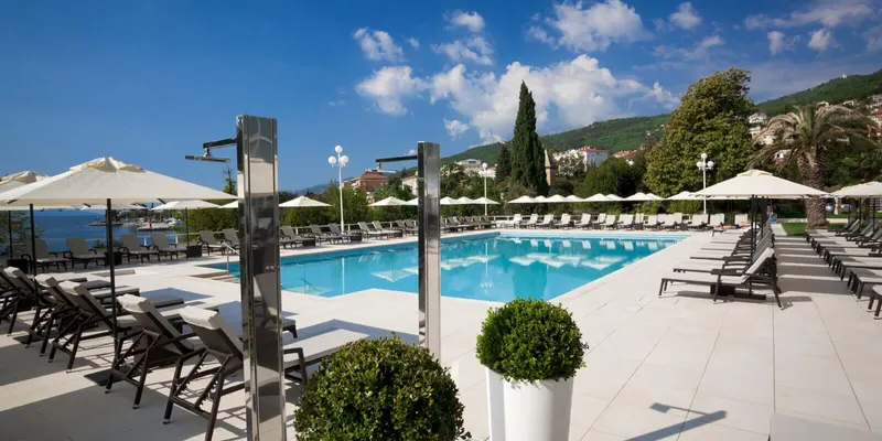 Outdoor pool deck with umbrellas