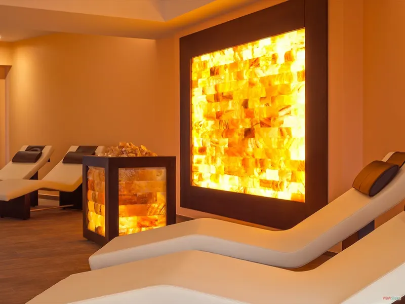 Spa relaxation room with a lit salt wall