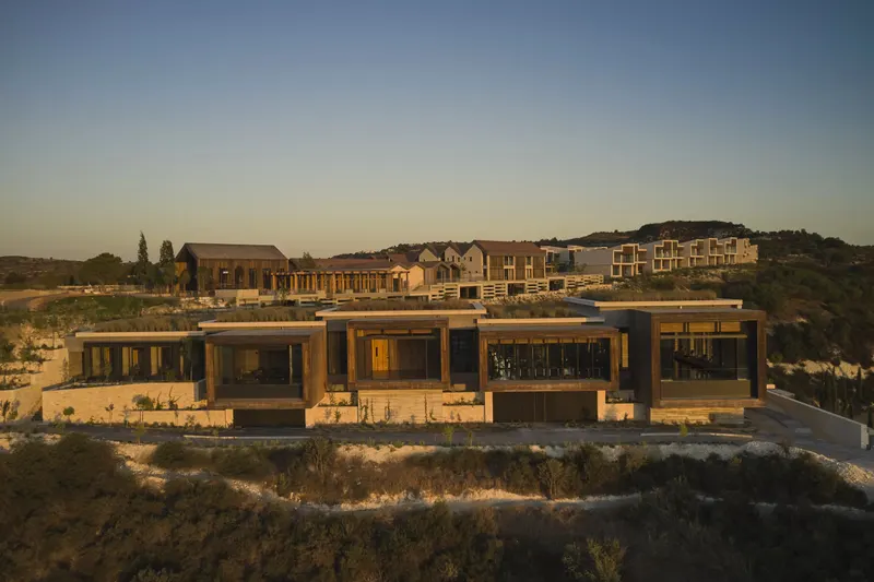 Spa building on the hillside at sunset
