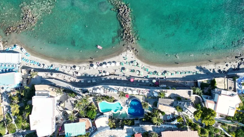 Aerial view of the Sant'Angelo beach, turquoise sea and the village