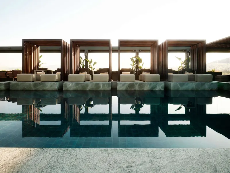 Rooftop pool cabanas reflected in the water