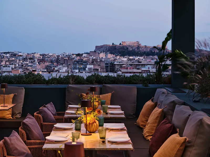 Rooftop terrace tables with a view of the Acropolis