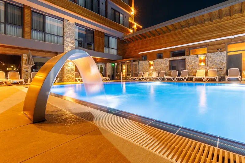 Pool with water arch in front of the hotel