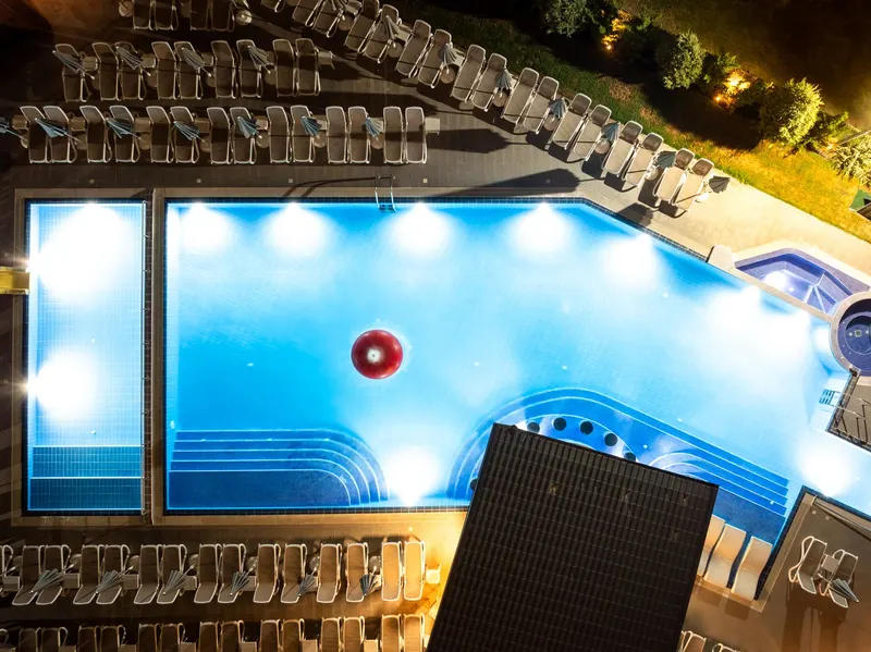 Aerial night view of the lit thermal pools