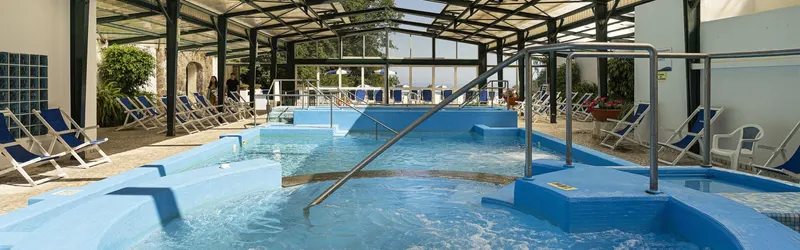 Thermal pool with sun loungers